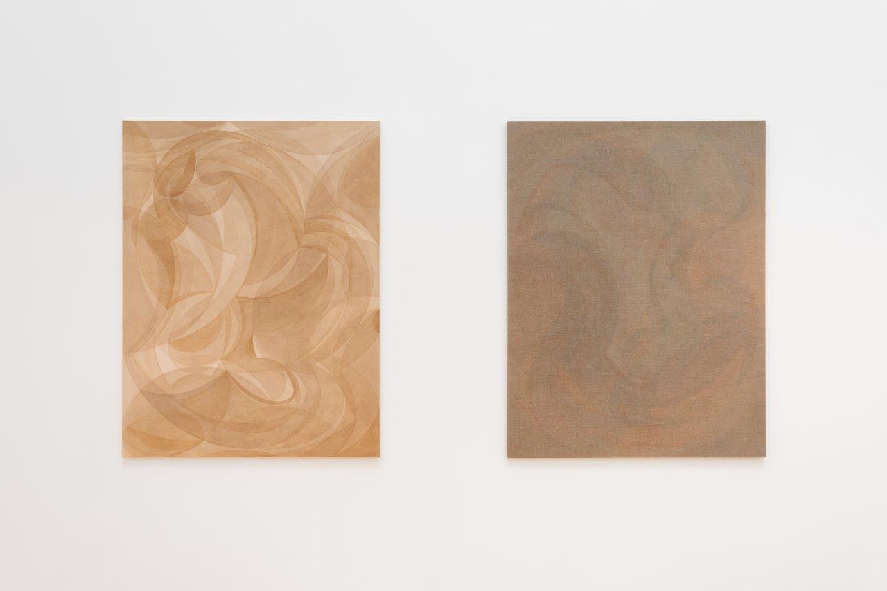 Two paintings hung in a gallery. Both are brown and beige, with a gentle swirling pattern across their surface.