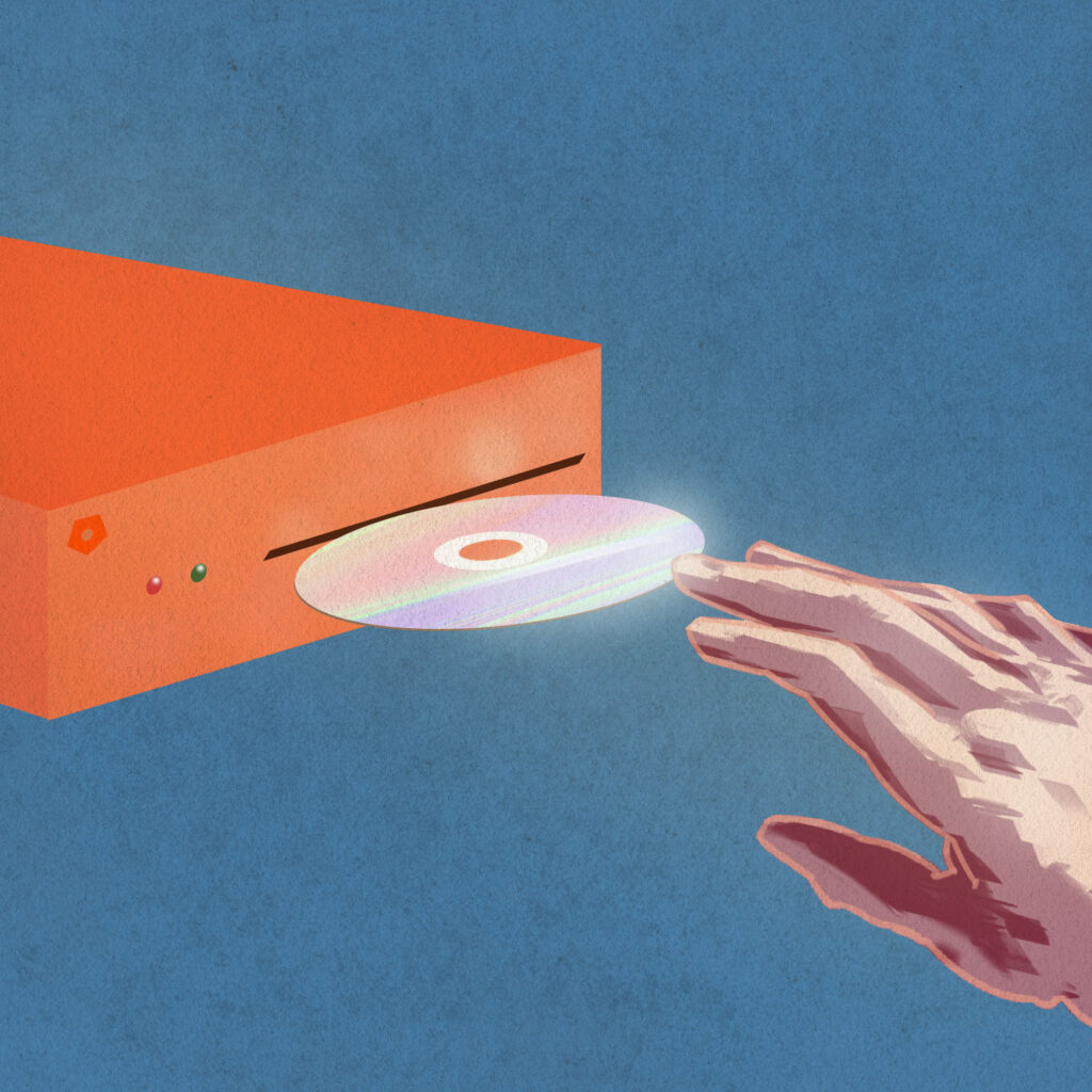 An illustration of a hand inserting a shiny CD into a bright orange game consul, against a blue background. 
