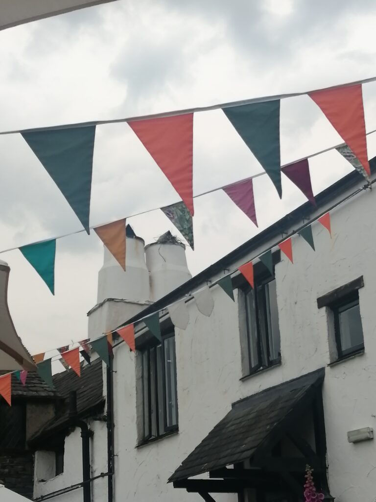 Photograph of the exterior of The Farmer's Arms with bunting.
