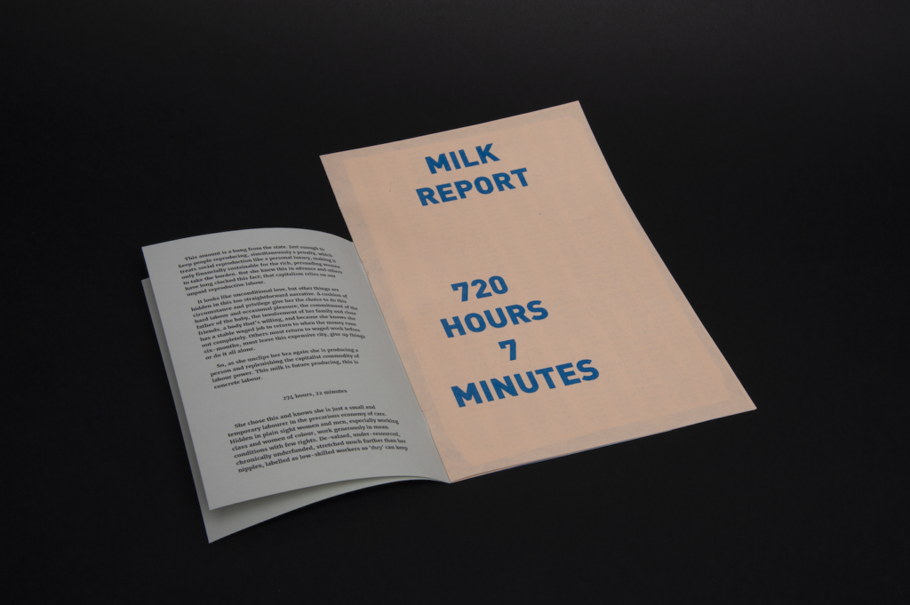An open paper booklet with a large peach coloured insert page with blue caps title 'MILK REPORT, 720 HOURS 7 MINUTES'