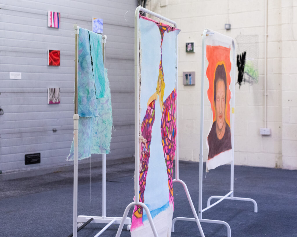 Instillation shot of an exhibition of paintings