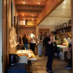 Interior shot of one of Grand Union's studios with people laughing and having a good time at an open studio event