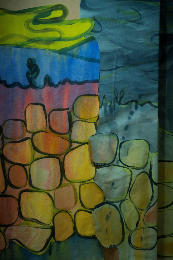 Detail of a colourful painting of a drystone wall.