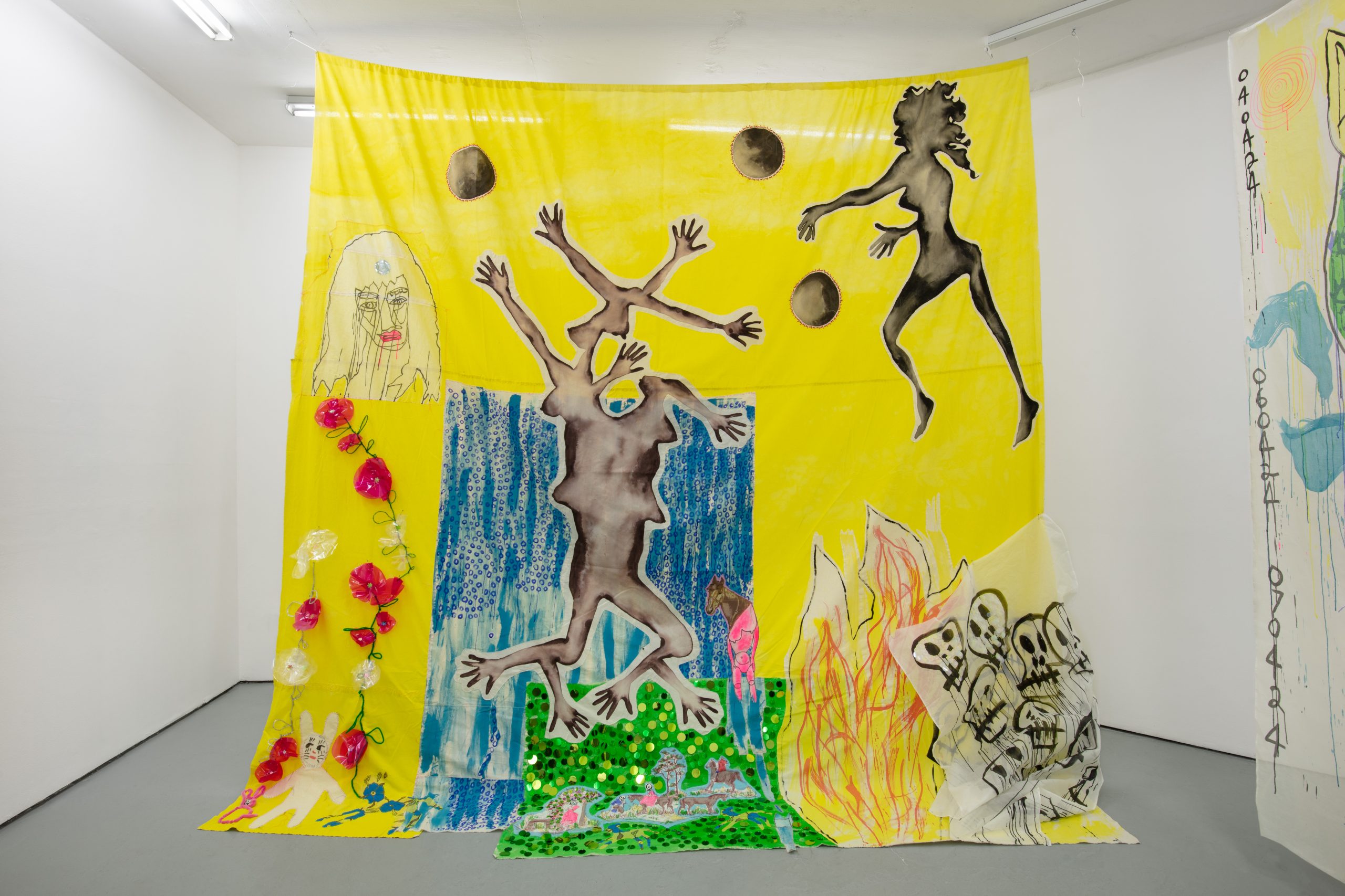 A collaged drawing on a yellow sheet contains female forms with too many hands and breasts, but no feet. Cartoon skulls are placed by a scribbled fire. A woman's head floats, dismembered, above a string of flowers.