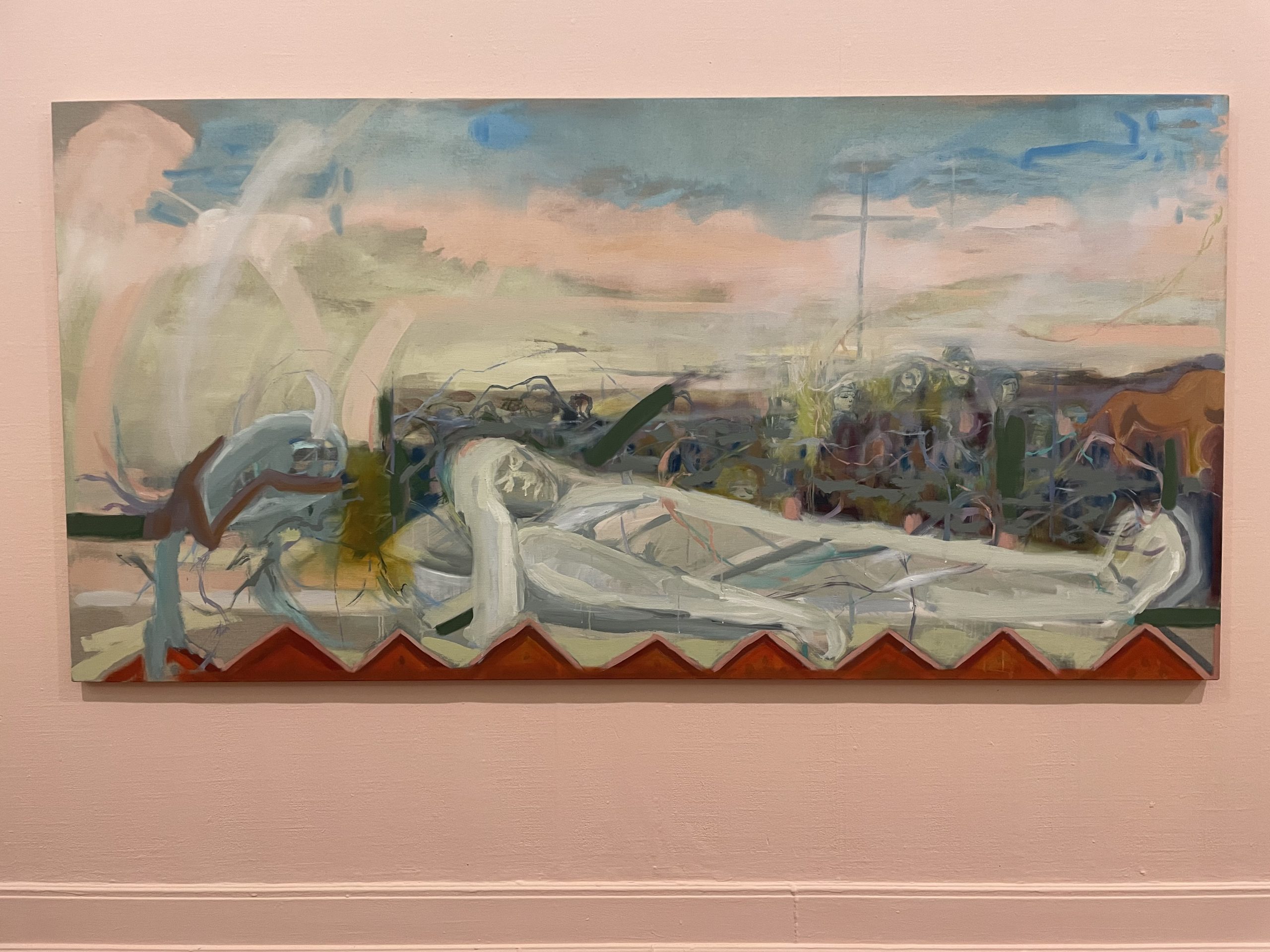 A painting of blue and pink skies with a shrouded figure in the foreground