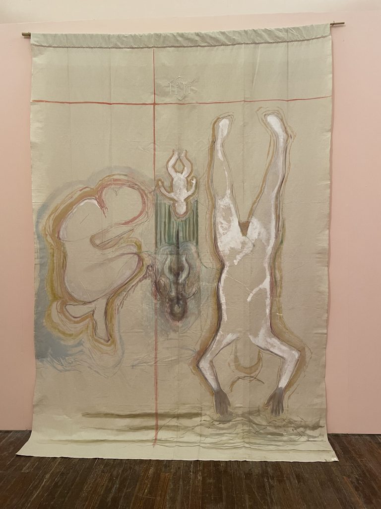 A creamy banner with line drawings of human figures swimming down towards the ground and on the left a fetus like shape