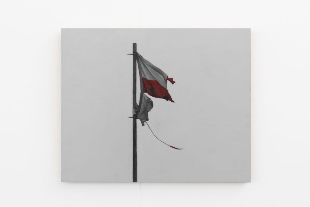 A painted of a ragged England flag on a flagpole.