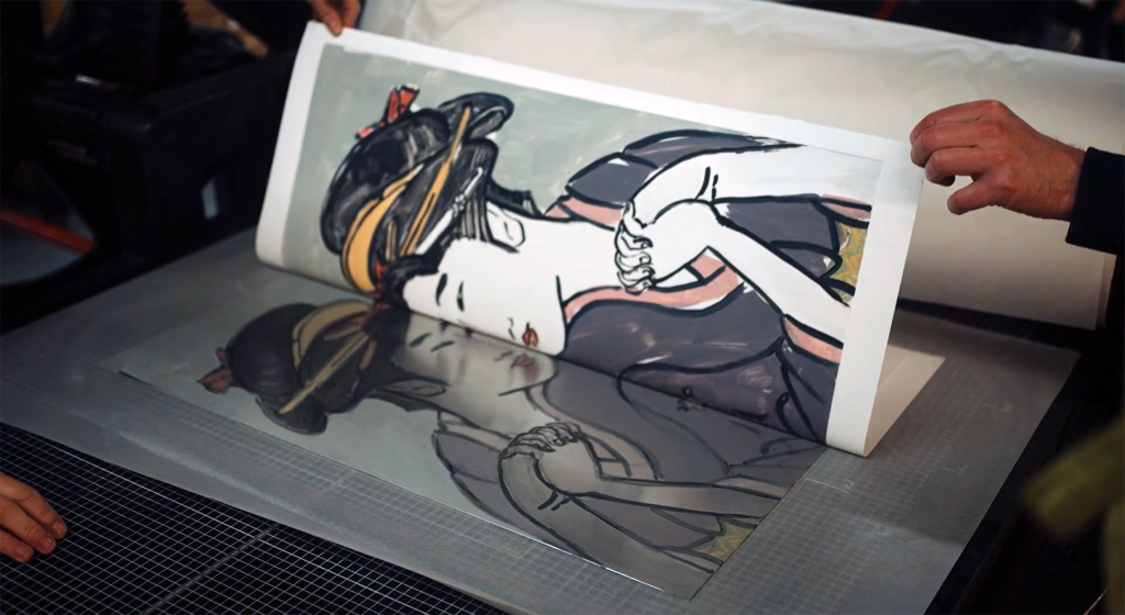 A print of a woman in traditional Japanese dress being peeled off the plate