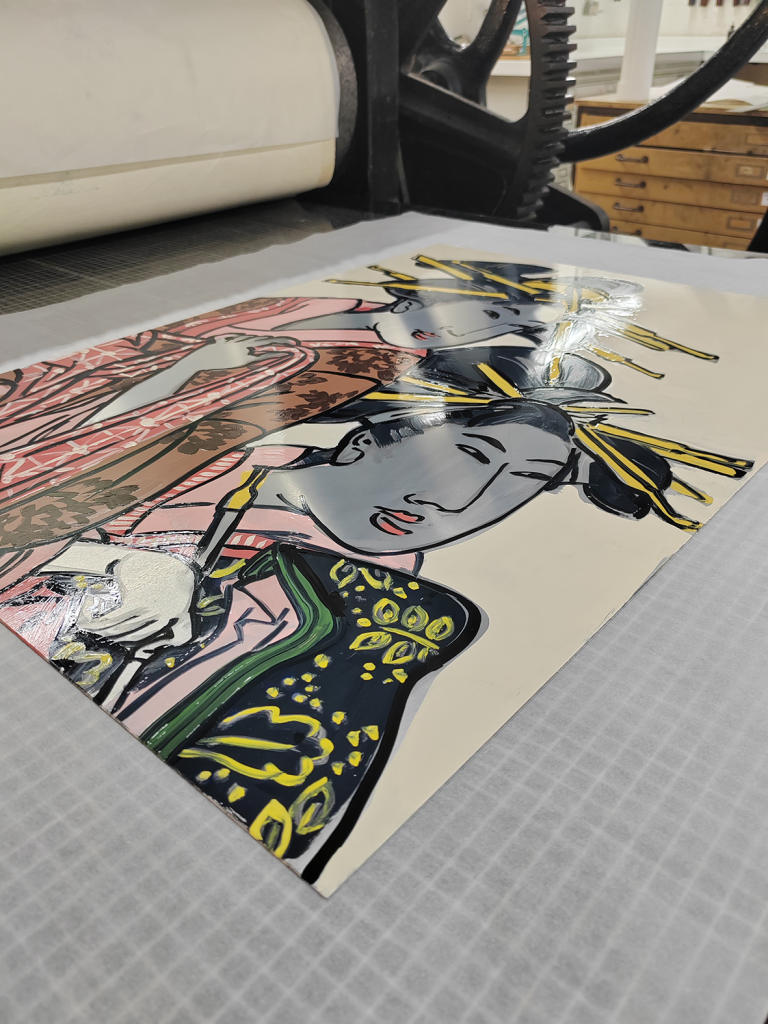 A shining wet print of an image of a woman in traditional Japanese dress