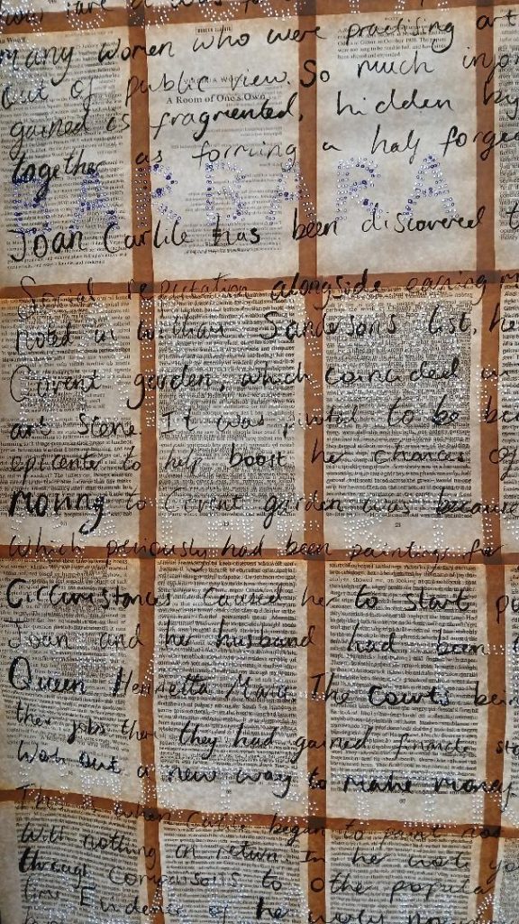 A grid of separated book print pages overwritten with looping black handwriting