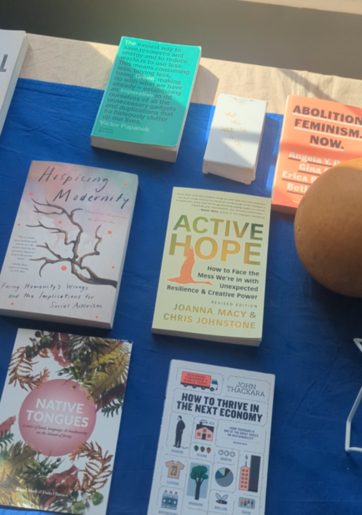 A table with a variety of books and leaflets on