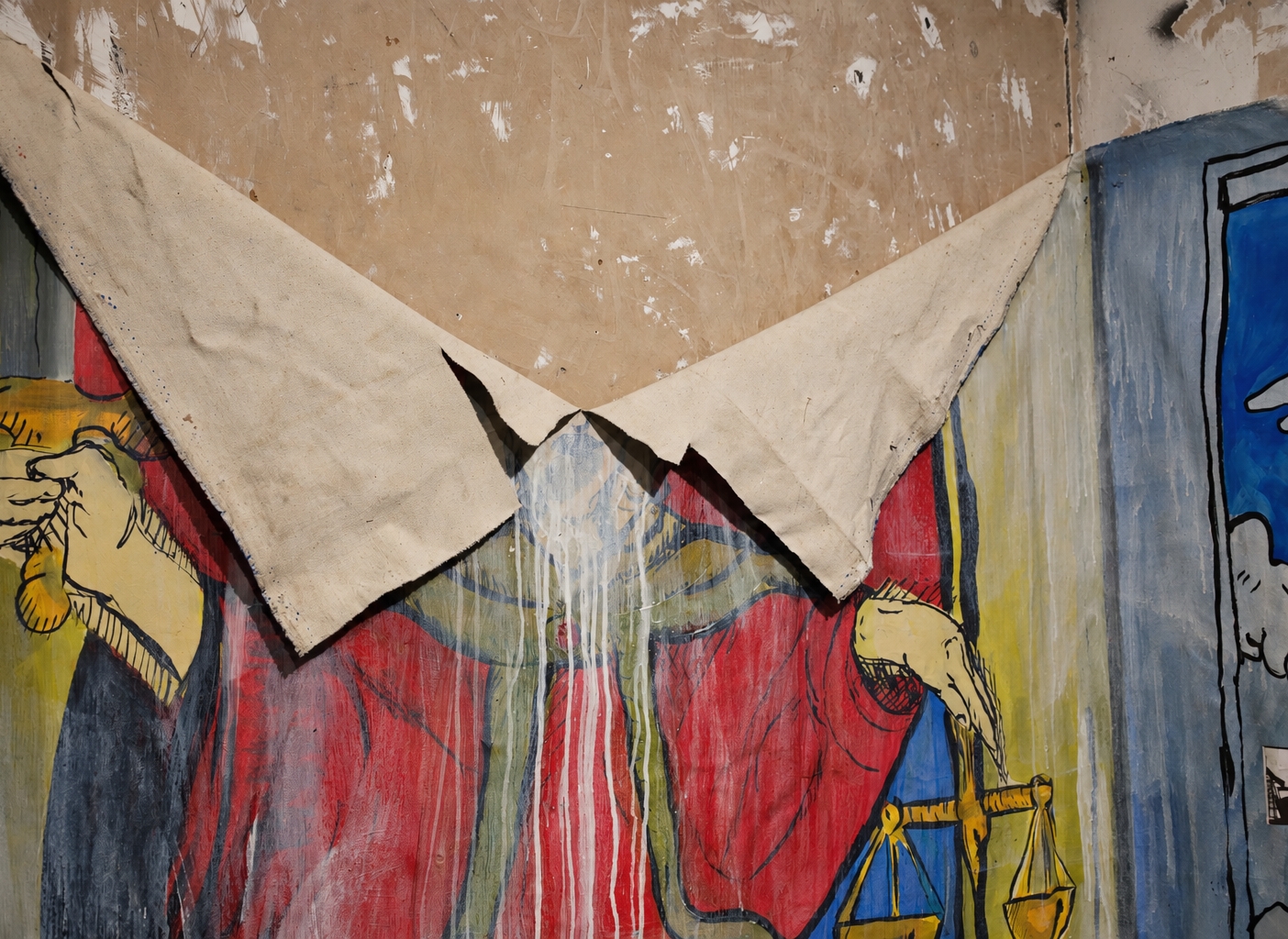 A torn painting on canvas of the Justice tarot, splashed with white paint, installed on a bare plaster wall
